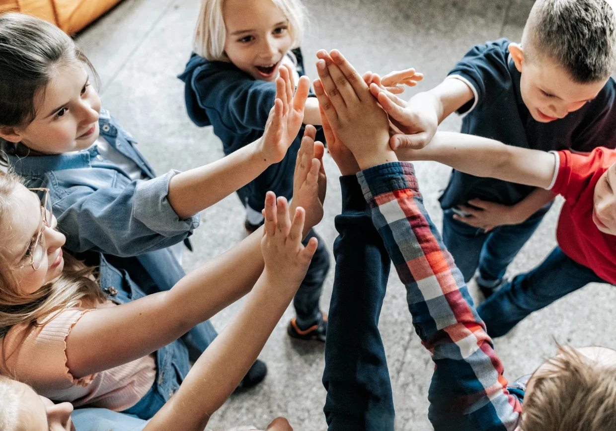 Children joining hands in a circle